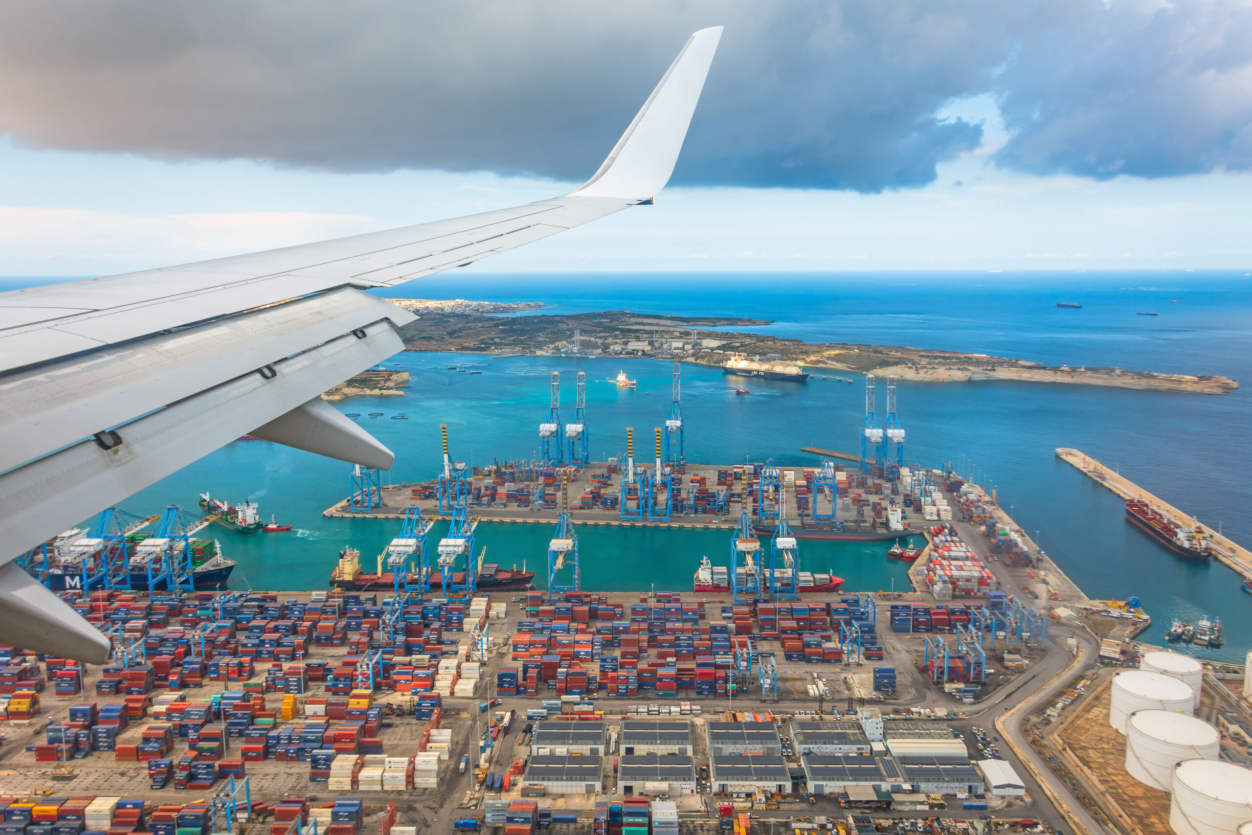 The port transporting containers. Wing view of Marsaxlokk, Malta